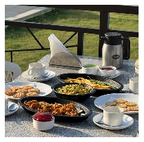 A breakfast table with a scenic outdoor view